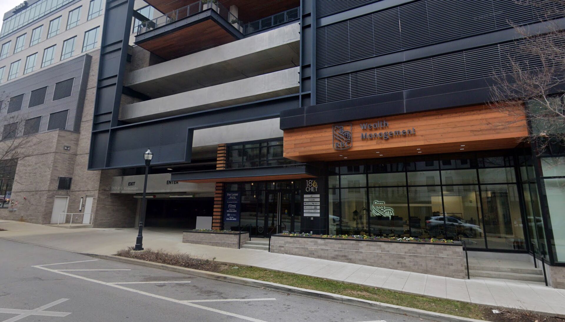 Nashville ascendly marketing office building with glass entrance.