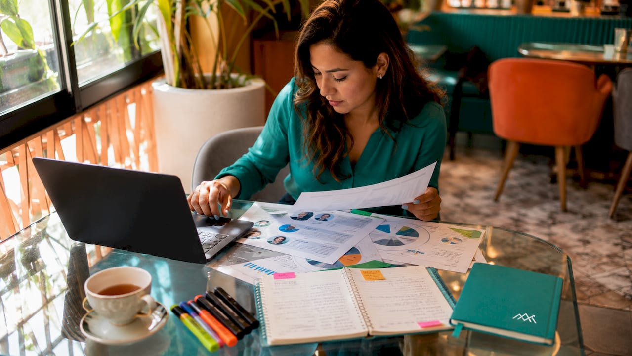 Woman analyzing audience data at desk