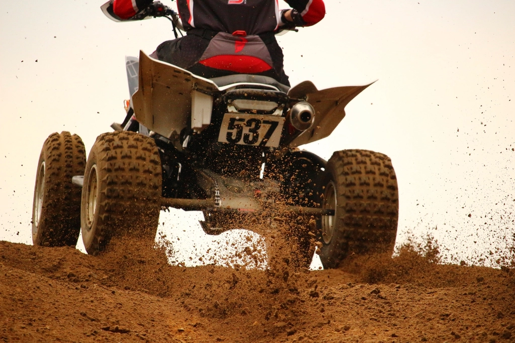 Atv rider on a dirt track; illustrative image for powersports case study